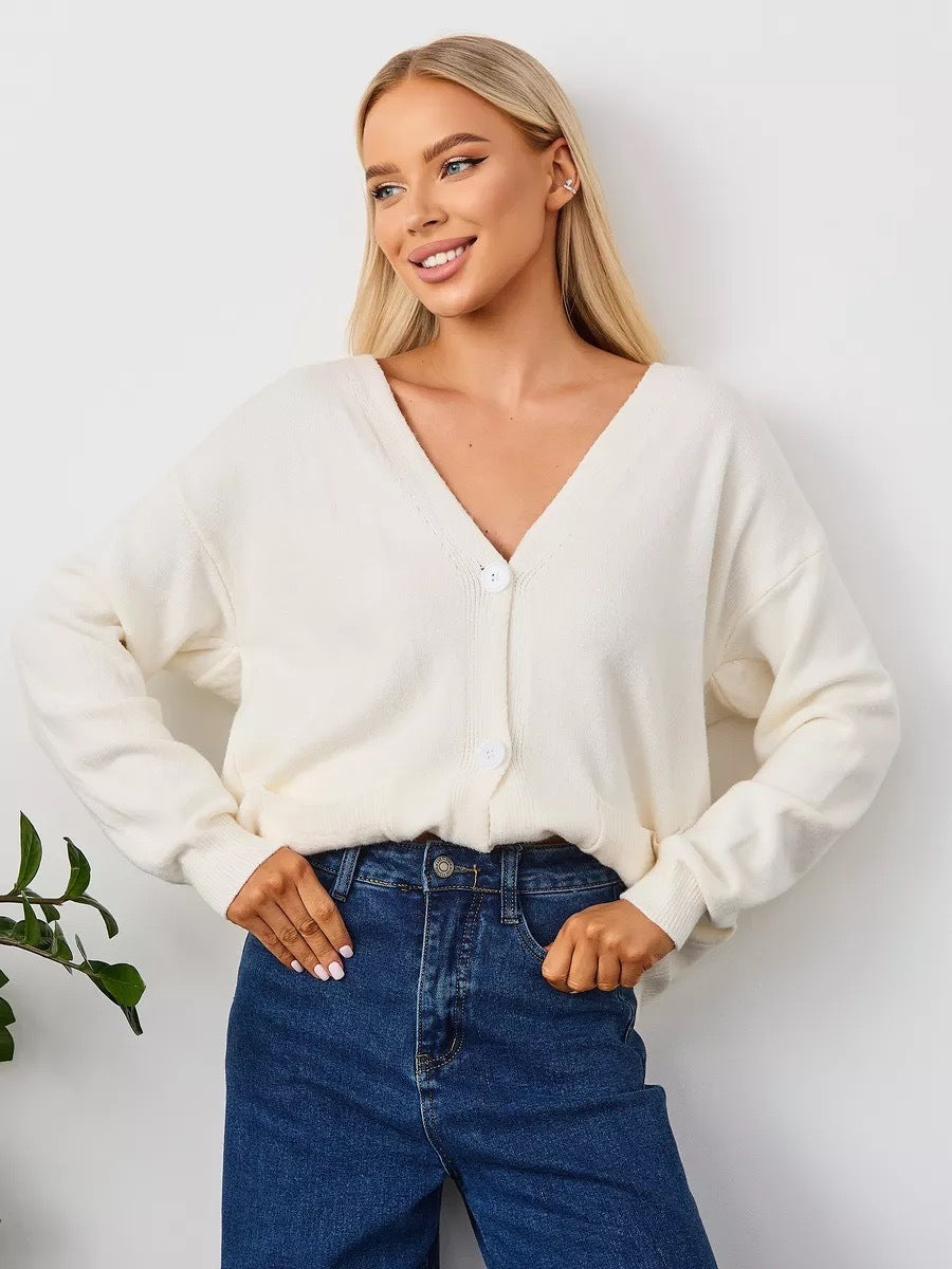 Løs cardigan med påsatte lommer