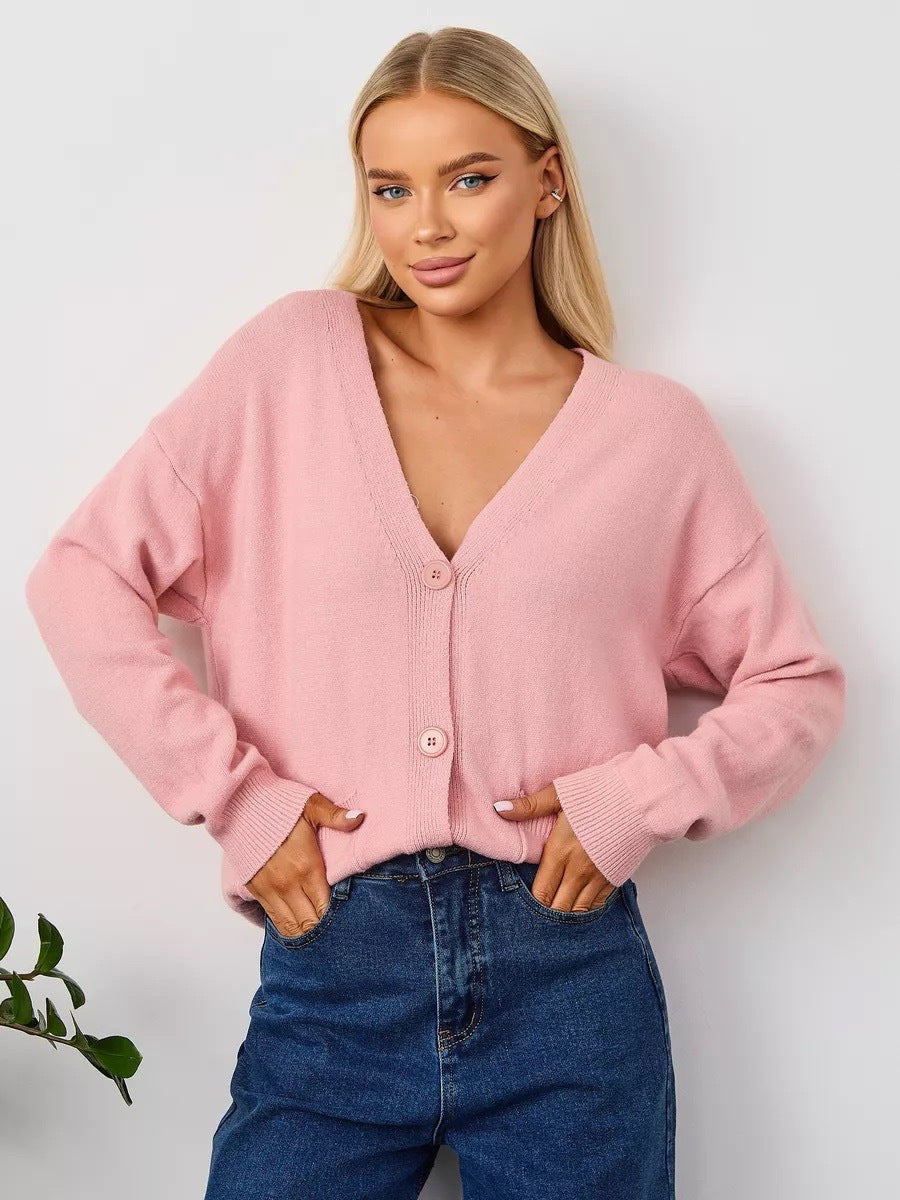 Løs cardigan med påsatte lommer