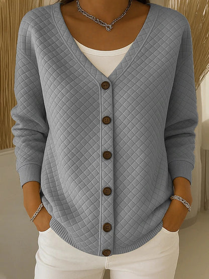 Quiltet cardigan med lommer og knapper
