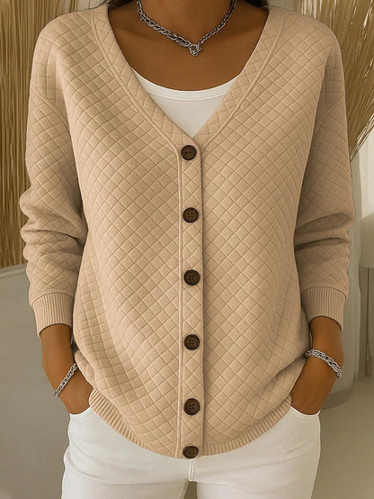 Quiltet cardigan med lommer og knapper